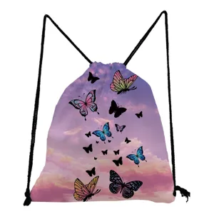 Detailed closeup of the butterfly print drawstring backpack featuring pink sky design and black cords.