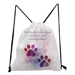White canvas drawstring backpack featuring watercolor paw print and motivational quote.