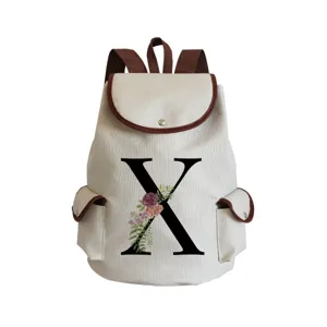 Canvas backpack with floral letter X print, brown trim, daily casual school bookbag.