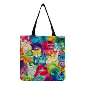 Close up detail view of the colorful watercolor cat print canvas shoulder tote bag pattern.