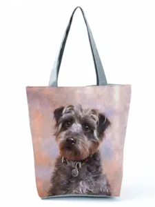 Detailed view of the large capacity tote bag with cute dog print and grey handles.