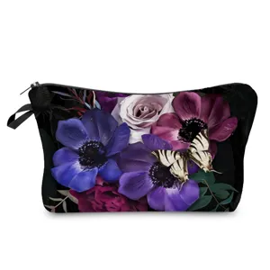 Trousse de maquillage imprimé floral sombre avec fermeture éclair pour rangement de voyage.