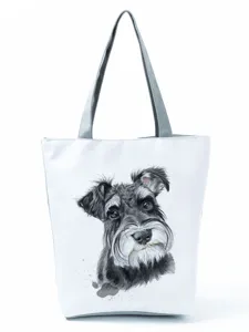 Detailed view of the watercolor Schnauzer dog print on the white canvas tote bag.