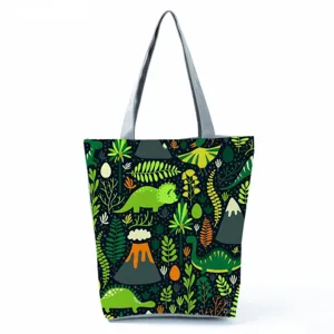 Vista dettagliata della borsa tote in tela con stampa di simpatici dinosauri.