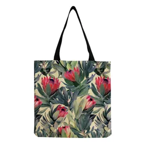 Vista dettagliata della borsa tote con stampa floreale, motivi botanici e manici resistenti.