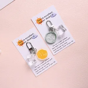 Creative lemon and ice cube keychain, cute fruit bag charm and sweet fashion gift detail.