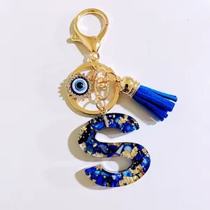 Blue letter S keychain with evil eye charm and tassel stylish accessory for bags and keys
