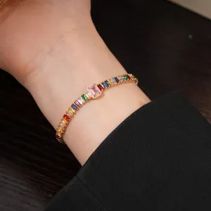 Gorgeous gold plated tennis bracelet with colorful baguette cubic zirconia stones for women.