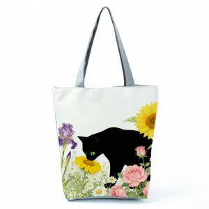Detailed view of the black cat floral canvas tote bag, featuring vibrant watercolor design.