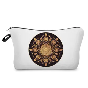 Detailed view of white cosmetic bag with golden mandala print, zipper closure and handy strap.