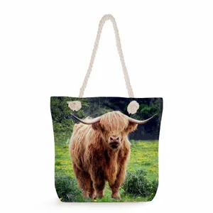 Highland cow print canvas tote bag with thick rope handles, large capacity casual shoulder bag.