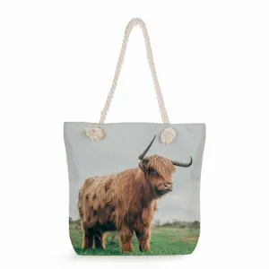 Highland cow print canvas tote bag detail, featuring thick rope handles and spacious interior.