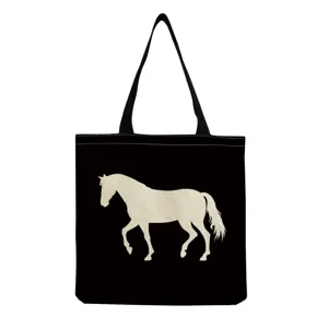Detailed view of black canvas tote bag featuring a stylish beige horse silhouette print design.