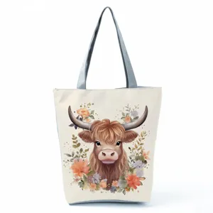 Detailed close-up view of the cute watercolor highland cow print canvas tote bag.