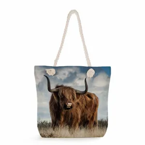 Highland cow print canvas tote bag with thick rope handles, large capacity casual shoulder bag.
