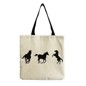 Canvas tote bag with black handles and running horse silhouettes print for daily use.
