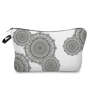 Detail view of black and white mandala printed cosmetic bag, showing intricate geometric patterns.