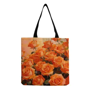 Vue détaillée du grand cabas en toile avec imprimé de roses orange style peinture à l'huile.