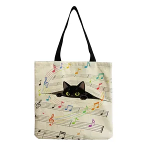 Close-up detail of the canvas tote bag featuring cute black cat and colorful musical notes.