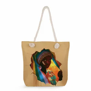Vue détaillée du sac en toile avec un portrait artistique de femme africaine et poignées.