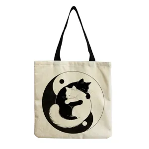 Canvas tote bag featuring a cute black and white cat yin-yang print, perfect for daily shopping.