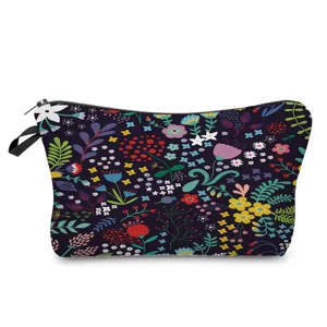 Close-up of the vibrant floral print makeup bag, showing the colorful botanical pattern details.