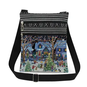 Detailed view of the Christmas village print crossbody bag with black white striped top and zippers.