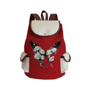 Red canvas backpack with white flap pocket and floral butterfly print design details.