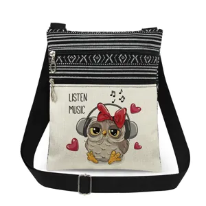 Small canvas crossbody bag with cute owl print double zipper design and adjustable strap.