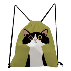 Detail view of the cute black and white cat graphic printed on the green canvas drawstring backpack.