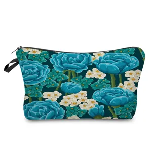 Close-up view of the blue floral print cosmetic bag showcasing the detailed vibrant pattern.