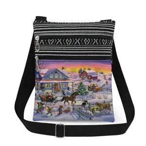 Detail shot of the Christmas print crossbody bag with double zippers and black strap.