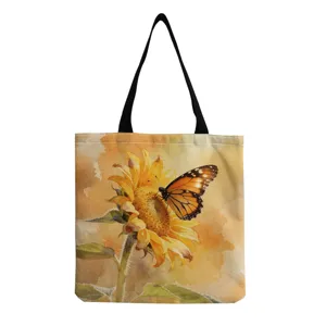 Close-up of the watercolor sunflower and butterfly print on the canvas tote bag fabric.