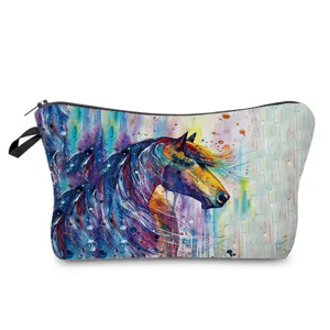 Closeup detail of colorful watercolor horse print cosmetic makeup bag zipper closure fabric.