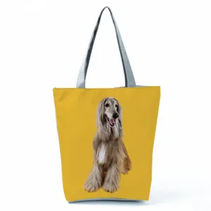 Detailed close-up of the stylish printed tote bag showcasing the cute dog pattern and sturdy handles.