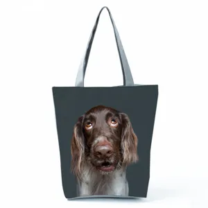 Close-up detail of cute dog print on dark grey fabric tote bag, ideal for casual daily use.
