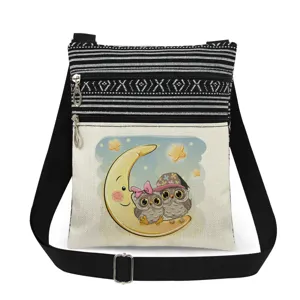 Cute owl print crossbody bag with double zippers, black striped canvas and adjustable strap.