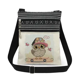 Detailed view of the cute owl printed canvas crossbody bag featuring adjustable black strap and dual zippers.