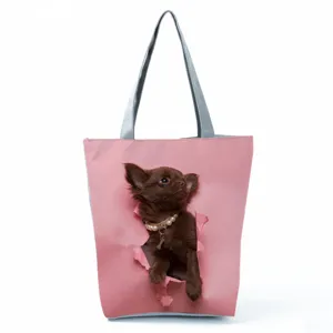 Chic pink tote bag featuring a 3D cute brown puppy print and sturdy grey straps.