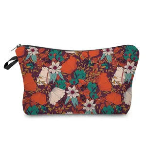 Detailed view of the vibrant vintage floral cosmetic pouch with secure zipper closure.