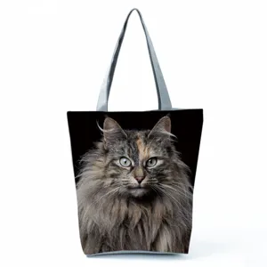 Close-up detail showing the realistic long-haired cat print texture on the canvas tote bag.