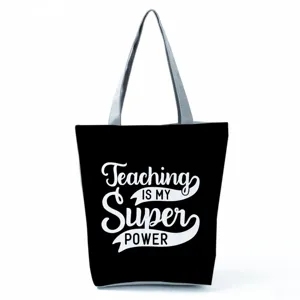 Large capacity canvas tote bag with teacher letter print, casual shoulder bag for daily use.