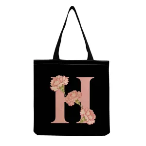 Sac cabas en toile noire avec imprimé lettre H et fleurs roses, sac shopping femme lavable.