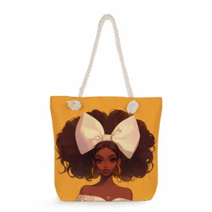 Détail du sac cabas fourre-tout stylé avec imprimé artistique, nœud blanc et anses en corde.