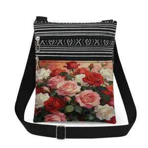 Close-up detail of vintage oil painting rose print on black and white canvas bag.