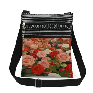 Detailed view of the vintage rose print crossbody bag featuring double zippers and strap.