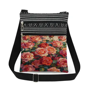 Detail shot of the floral print pocket and black white striped pattern on the crossbody bag.