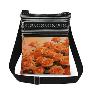 Orange rose print crossbody bag with black and white striped top and double zippers.