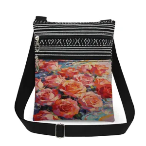 Detailed view of the canvas crossbody bag featuring vibrant oil painting rose prints and zippers.