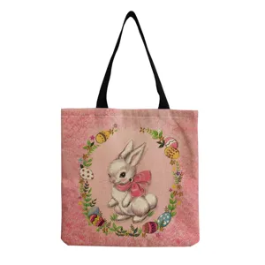 Schattig paaskonijn print detail op roze canvas tote tas met een handige zwarte handgreep.